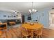 Open floor plan showcases dining area, living room, and cohesive design at 8401 N 55Th Ave, Glendale, AZ 85302