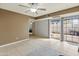 Spacious living room with outdoor access, neutral colors, and tile floors at 8401 N 55Th Ave, Glendale, AZ 85302