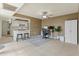 Open-concept area with kitchen bar, dedicated office space, and tile flooring throughout at 8401 N 55Th Ave, Glendale, AZ 85302