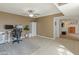 Functional office with desk setup, storage cabinet, and access to hall at 8401 N 55Th Ave, Glendale, AZ 85302