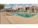 A community pool with lounge chairs, tables, and a covered area that offers a refreshing escape at 8401 N 55Th Ave, Glendale, AZ 85302