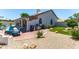 Large backyard with an outdoor fireplace, pool, and barbeque at 9032 E Larkspur Dr, Scottsdale, AZ 85260