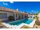 Private backyard features a sparkling pool, covered patio, mature landscaping, and space to entertain at 9032 E Larkspur Dr, Scottsdale, AZ 85260