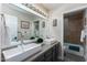 Bathroom with double vanity and a large mirror at 9032 E Larkspur Dr, Scottsdale, AZ 85260
