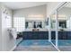 Spacious bathroom with double sinks, vanity, stylish mirrors, and unique design elements at 9032 E Larkspur Dr, Scottsdale, AZ 85260