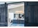 Bathroom with double sinks, modern lighting, and a barn door entrance at 9032 E Larkspur Dr, Scottsdale, AZ 85260