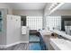 Bright bathroom with a walk-in shower and double sinks at 9032 E Larkspur Dr, Scottsdale, AZ 85260