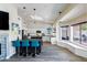 Bright kitchen featuring white cabinets, dark countertops, a breakfast bar, and skylights at 9032 E Larkspur Dr, Scottsdale, AZ 85260