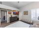 Bedroom with a ceiling fan and a TV above a gray dresser at 9032 E Larkspur Dr, Scottsdale, AZ 85260