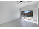 Bedroom with a view of the pool through sliding glass doors, creating a serene and private retreat at 9631 E Palm Ridge Dr, Scottsdale, AZ 85260