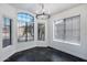 Bright dining room with large windows offering natural light and a chandelier adding a touch of elegance at 9631 E Palm Ridge Dr, Scottsdale, AZ 85260