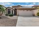 Inviting single-story home showcasing a desert landscape, tile roof, and a neutral-toned facade at 9631 E Palm Ridge Dr, Scottsdale, AZ 85260