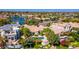 Aerial view showcasing backyard pools and water views in a residential neighborhood at 10421 N 100Th St, Scottsdale, AZ 85258