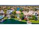 Aerial view of waterfront homes, private docks, and lush landscaping at 10421 N 100Th St, Scottsdale, AZ 85258