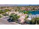 Picturesque aerial view of a residential area, showcasing waterfront homes amidst mature trees at 10421 N 100Th St, Scottsdale, AZ 85258