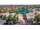 Stunning aerial view of luxury homes nestled along a serene lake, showcasing picturesque waterfront living at 10421 N 100Th St, Scottsdale, AZ 85258