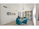 Dining area showcasing a glass table, blue chairs, and large shutters at 10421 N 100Th St, Scottsdale, AZ 85258