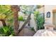 Charming entrance to a single-Gathering home, adorned with palm trees and a welcoming front door at 10421 N 100Th St, Scottsdale, AZ 85258