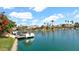 Beautiful lake view featuring boat dock, lush landscaping and waterfront homes at 10421 N 100Th St, Scottsdale, AZ 85258