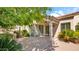 Inviting patio with a column, ceiling fan and desert landscaping, great for outdoor living at 10421 N 100Th St, Scottsdale, AZ 85258