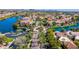 Aerial view of street lined with palm trees in waterfront community, showcasing luxury homes and serene waterways at 10421 N 100Th St, Scottsdale, AZ 85258