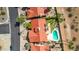 Aerial view of backyard oasis with pool, lush landscaping, and red tile roof at 10563 E Bella Vista Dr, Scottsdale, AZ 85258