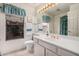 Bright bathroom featuring a white vanity, matching toilet, coordinated decor and a window at 10563 E Bella Vista Dr, Scottsdale, AZ 85258