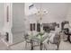 Open concept dining room with a fireplace, elegant chandelier, and seamless flow into the living space at 10563 E Bella Vista Dr, Scottsdale, AZ 85258