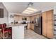 Modern kitchen with stainless steel appliances, light wood cabinets, and bright lighting at 10563 E Bella Vista Dr, Scottsdale, AZ 85258