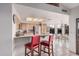 Bright kitchen overlooking the breakfast nook with light wood cabinets and stainless steel appliances at 10563 E Bella Vista Dr, Scottsdale, AZ 85258