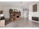 Open-concept living room featuring vaulted ceilings, a fireplace, and tile floors at 10563 E Bella Vista Dr, Scottsdale, AZ 85258