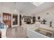 Bright and airy living room with vaulted ceilings, a skylight, and elegant decor at 10563 E Bella Vista Dr, Scottsdale, AZ 85258