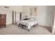 A sunlit bedroom features neutral carpet, a single bed, and four framed botanical prints adorning the wall at 10563 E Bella Vista Dr, Scottsdale, AZ 85258