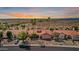 A well-kept single-Gathering home featuring desert landscaping, a red tile roof, and mature palm trees at 10563 E Bella Vista Dr, Scottsdale, AZ 85258