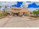 The Scottsdale Ranch Park Tennis Center entrance, framed by vibrant flowers and clear signage for easy access at 10563 E Bella Vista Dr, Scottsdale, AZ 85258