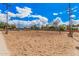 A well-maintained sand volleyball court ready for play under a bright, sunny sky at 10563 E Bella Vista Dr, Scottsdale, AZ 85258