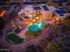 Aerial view of home with pool, putting green and solar panels, showcasing outdoor living at 10707 E Cottontail Ln, Scottsdale, AZ 85255