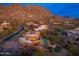 Desert home featuring a pool, spa, putting green, and lush landscaping all with a beautiful mountain in the background at 10707 E Cottontail Ln, Scottsdale, AZ 85255