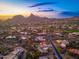 Expansive aerial view of luxury neighborhood showcasing desert landscape and mountain views at 10707 E Cottontail Ln, Scottsdale, AZ 85255