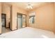 Bedroom featuring mirrored closet, a side bathroom and window at 10707 E Cottontail Ln, Scottsdale, AZ 85255