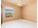 Cozy bedroom featuring neutral walls, white carpet and a ceiling fan at 10707 E Cottontail Ln, Scottsdale, AZ 85255