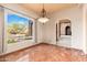 Bright dining room with a decorative floor and a view at 10707 E Cottontail Ln, Scottsdale, AZ 85255