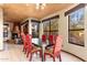 Spacious dining room featuring a fireplace and views from large windows at 10707 E Cottontail Ln, Scottsdale, AZ 85255