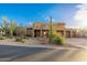 Exterior showcasing the desert landscaping and contemporary design of this residence at 10707 E Cottontail Ln, Scottsdale, AZ 85255