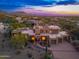 Stunning desert home boasts a three car garage, captivating desert landscaping and mountain views at 10707 E Cottontail Ln, Scottsdale, AZ 85255