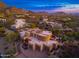 Luxurious desert home featuring a spacious three car garage, elegant landscaping and captivating mountain views at 10707 E Cottontail Ln, Scottsdale, AZ 85255