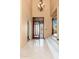 Bright foyer with decorative glass front door and stairway to the second floor at 10707 E Cottontail Ln, Scottsdale, AZ 85255