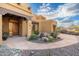 Beautiful front entrance with desert landscaping, rock water feature and mountain views at 10707 E Cottontail Ln, Scottsdale, AZ 85255