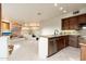 Kitchen with granite countertops, stainless appliances, custom cabinets and tiled floors at 10707 E Cottontail Ln, Scottsdale, AZ 85255