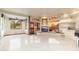 Large living room with custom media center, built-in bench seating and recessed lighting at 10707 E Cottontail Ln, Scottsdale, AZ 85255